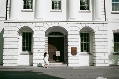 The woman stood outside the building
